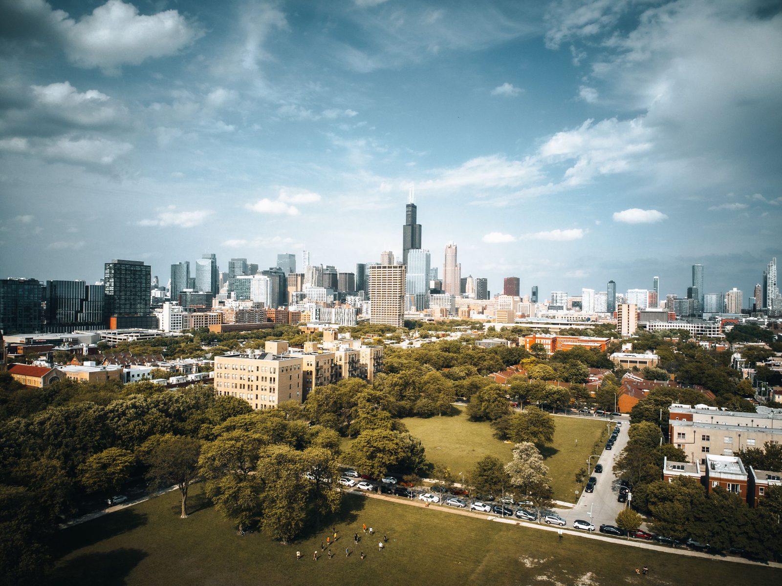Aerial view of a Chicago neighborhood park and skyline