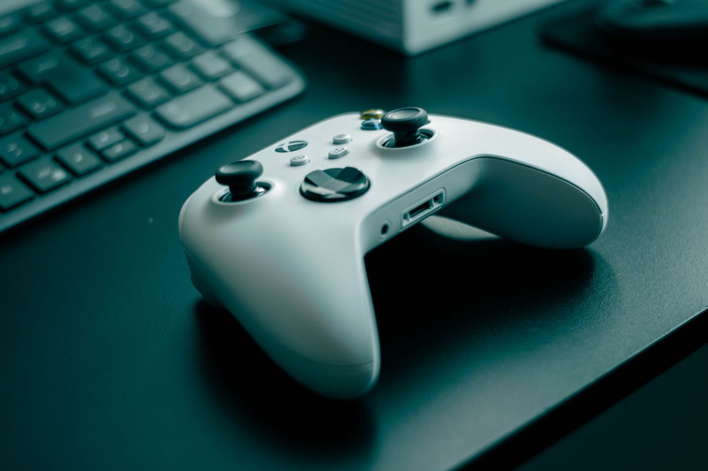 Xbox game controller on a desk, representing the video game industry